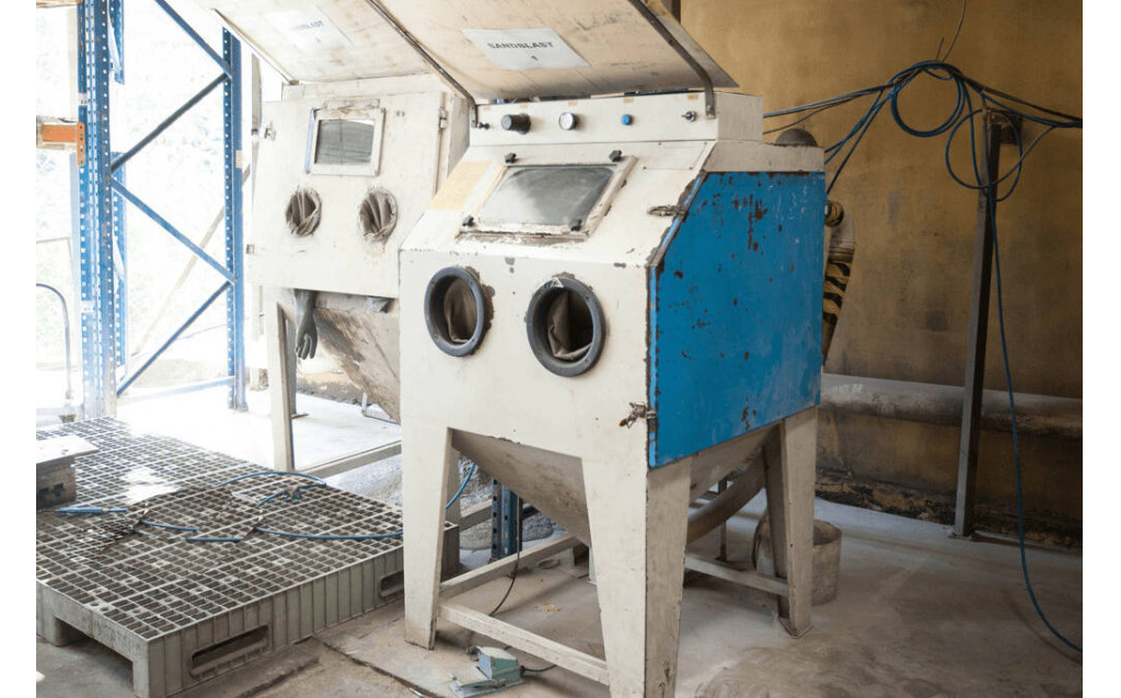 Fully assembled multi-cavity steel compression mold base prepared for industrial parts production.