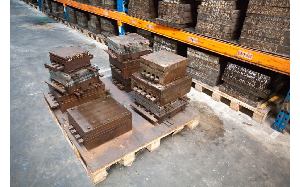 Advanced EDM wire-cut and spark erosion machinery operating inside the NK Rubber in-house tooling shop.