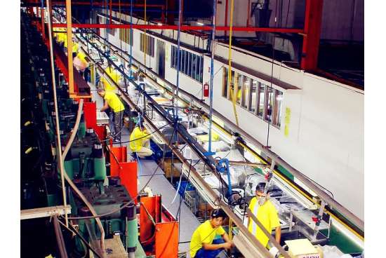 Heavy-duty hydraulic press machines operating in the custom rubber compression molding production area.