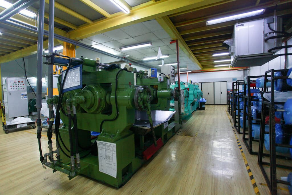 Industrial rubber manufacturing equipment and advanced machinery 5 at NK Rubber facility.