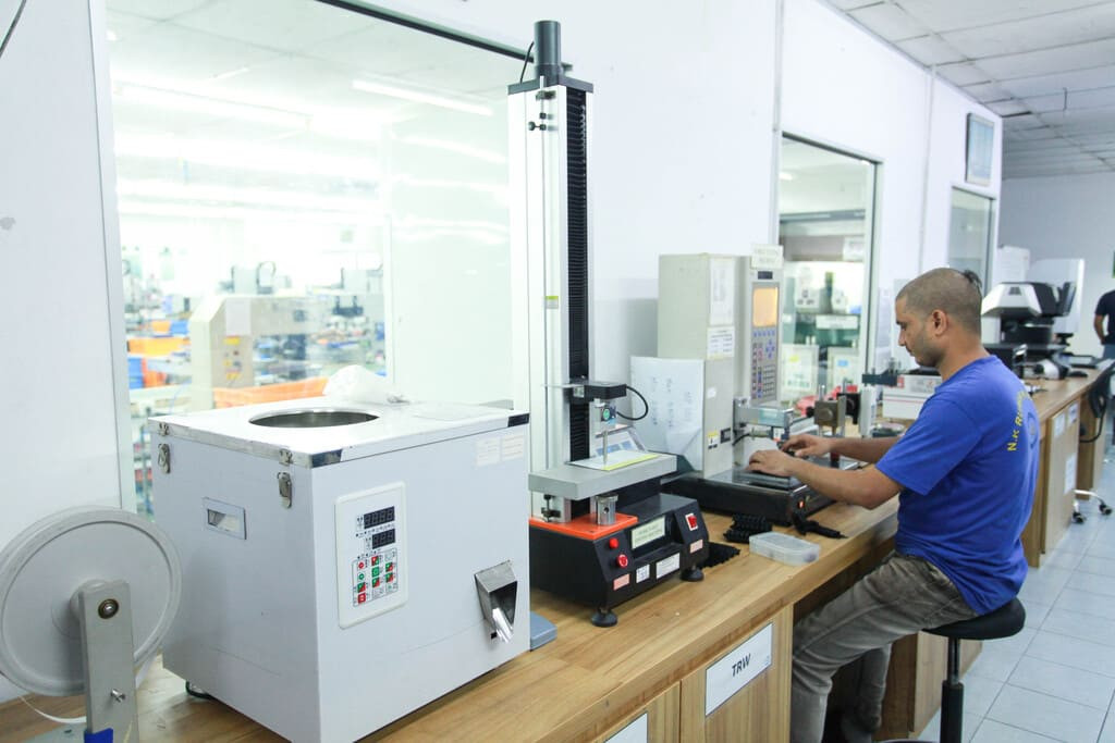 Industrial rubber manufacturing equipment and advanced machinery 12 at NK Rubber facility.