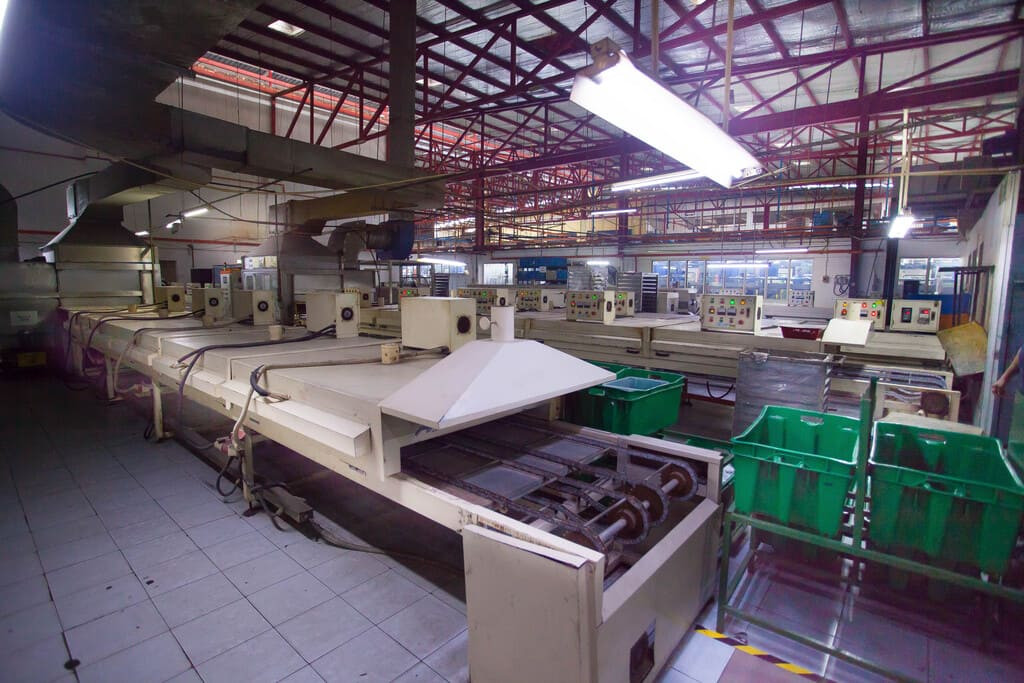 Industrial rubber manufacturing equipment and advanced machinery 20 at NK Rubber facility.