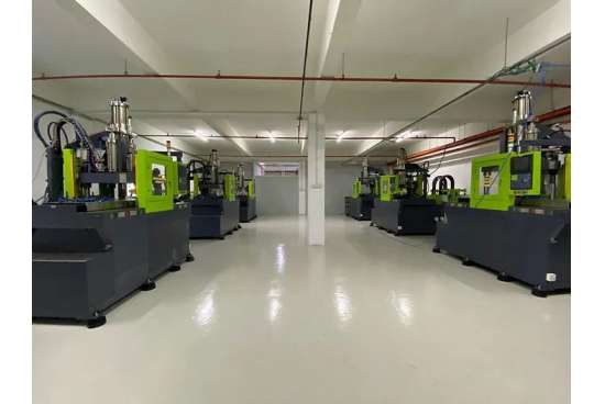 Automated Liquid Silicone Rubber (LSR) injection molding machines operating inside a controlled cleanroom facility.