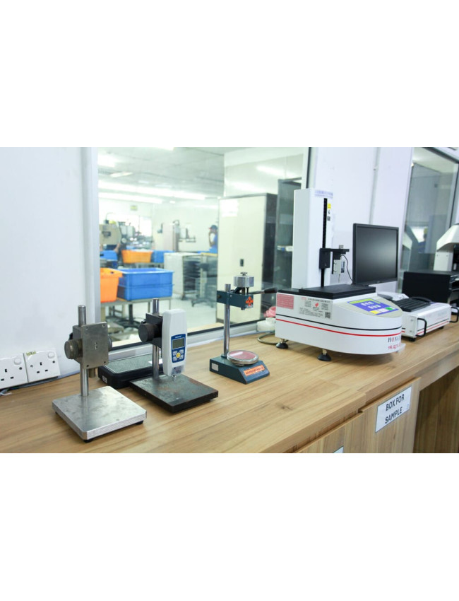 High-precision laboratory testing instrument for rubber component analysis.