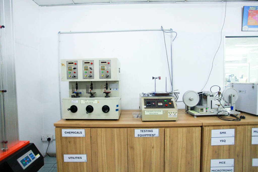 Quality assurance calibration tool inside the NK Rubber testing lab.