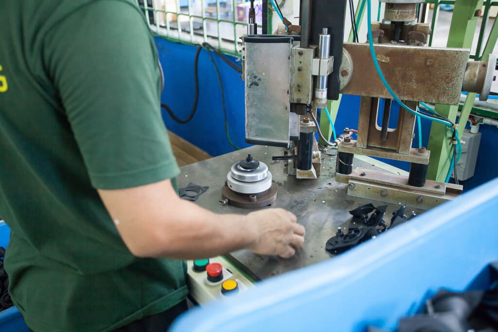 Semi-automated alignment fixtures ensuring secure mechanical bonding of multi-material components.