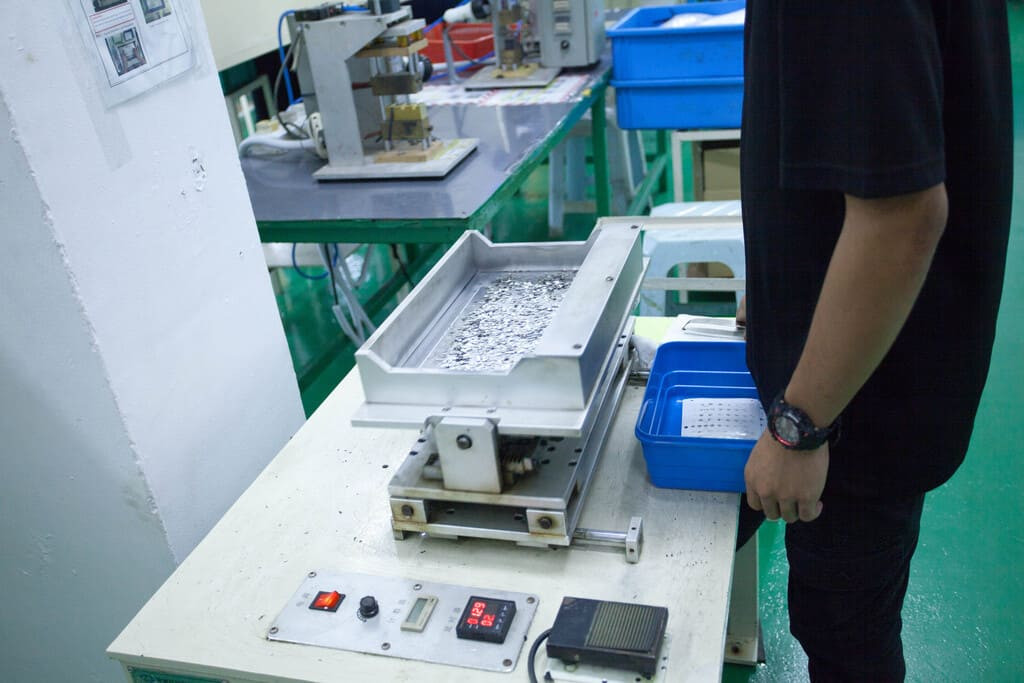 Secondary finishing operations and hardware structural inserting on rubber component modules.